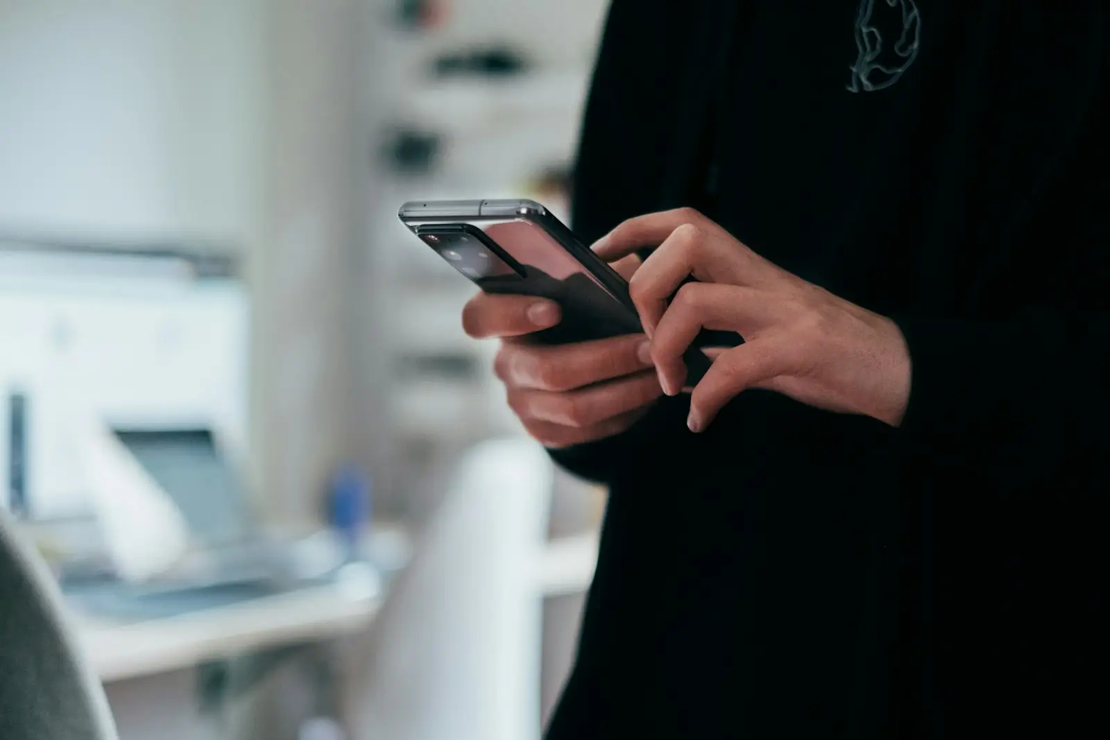 Hands holding a smartphone browsing a mobile site